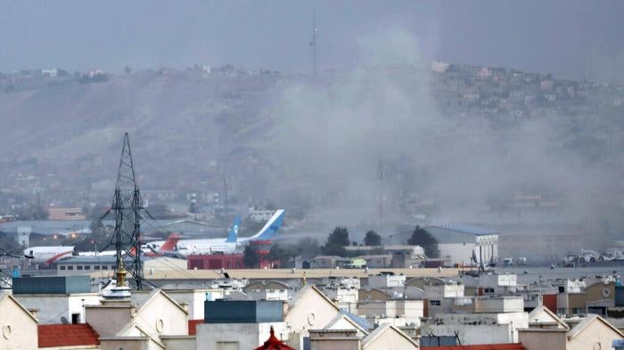 Smoke rises from an explosion outside the airport in Kabul, Afghanistan on August 26, 2021.
