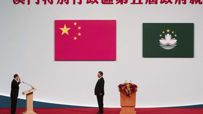 Macao Chief Executive Ho Iat Seng, left, reads his oath of office in front of Chinese leader Xi Jinping at the inauguration ceremony in Macao, December 20, 2019.