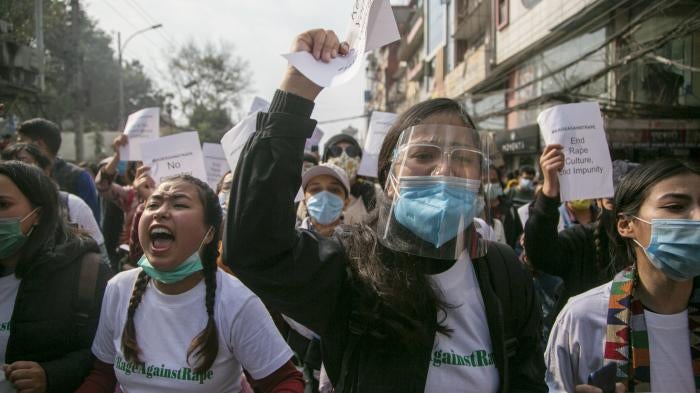 Nepalese women’s rights activists rallying in Nepal’s capital, Kathmandu, on February 12, 2021, to call for an end to violence and discrimination against women and the scrapping of a proposed law that would restrict travel for many women.