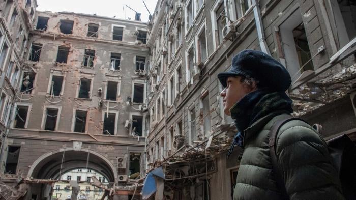 A local resident looks at his house destroyed in a Russian air raid in Kharkiv, Ukraine, March 3, 2022.