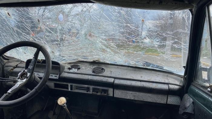 Maksym Maksymenko’s shot-up car in Hostomel, Ukraine. Russian forces opened fire on the vehicle on February 28, 2022 while Maksym was trying to evacuate with his mother, mother-in-law, wife, and their toddler son. Maksym and his wife were wounded, his mother died.