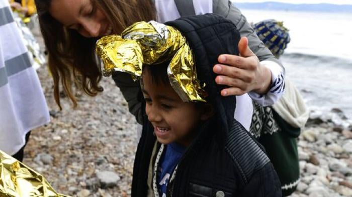 A boy from Afghanistan arriving on the Greek island of Lesbos after crossing the Aegean sea from Turkey, on Friday, Feb. 28, 2020. 