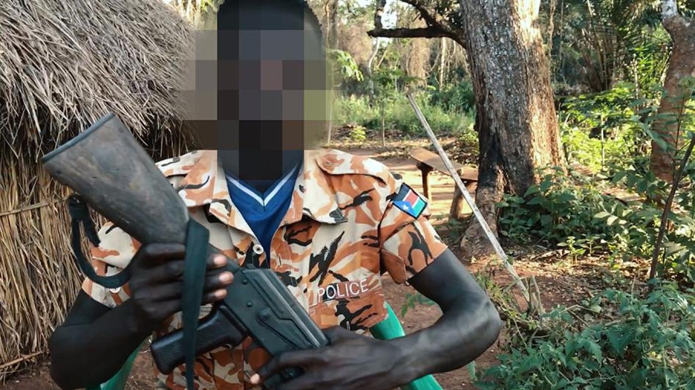 South Sudan Child soldier holding a gun.