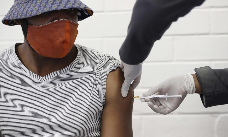A volunteer receives a Covid-19 test vaccine injection developed at the University of Oxford in Britain, during a clinical trial at the Chris Hani Baragwanath hospital in Soweto, Johannesburg, South Africa.