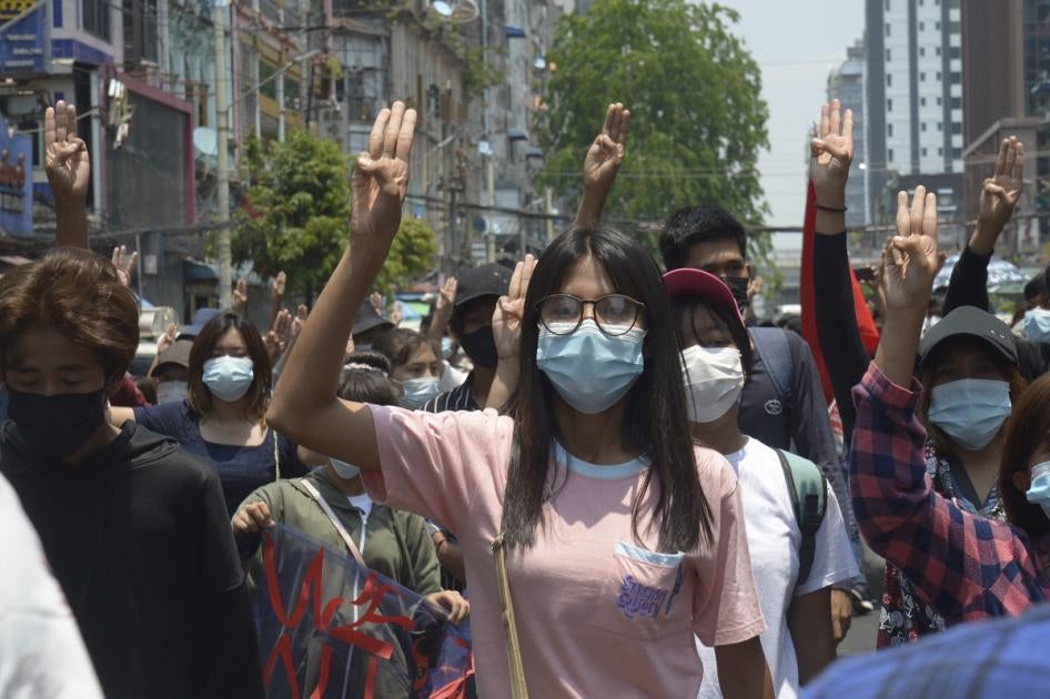 Anti-coup protesters flash the three-finger sign of defiance during a demonstration in Yangon, Myanmar on April 23, 2021.