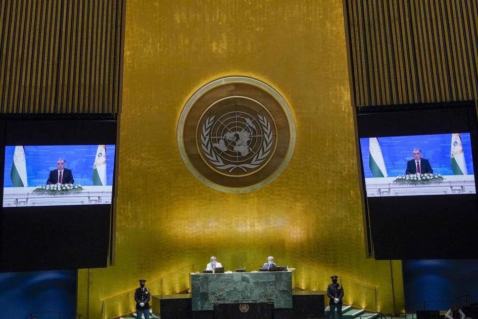 A man on two video screens in the UN general assembly hall