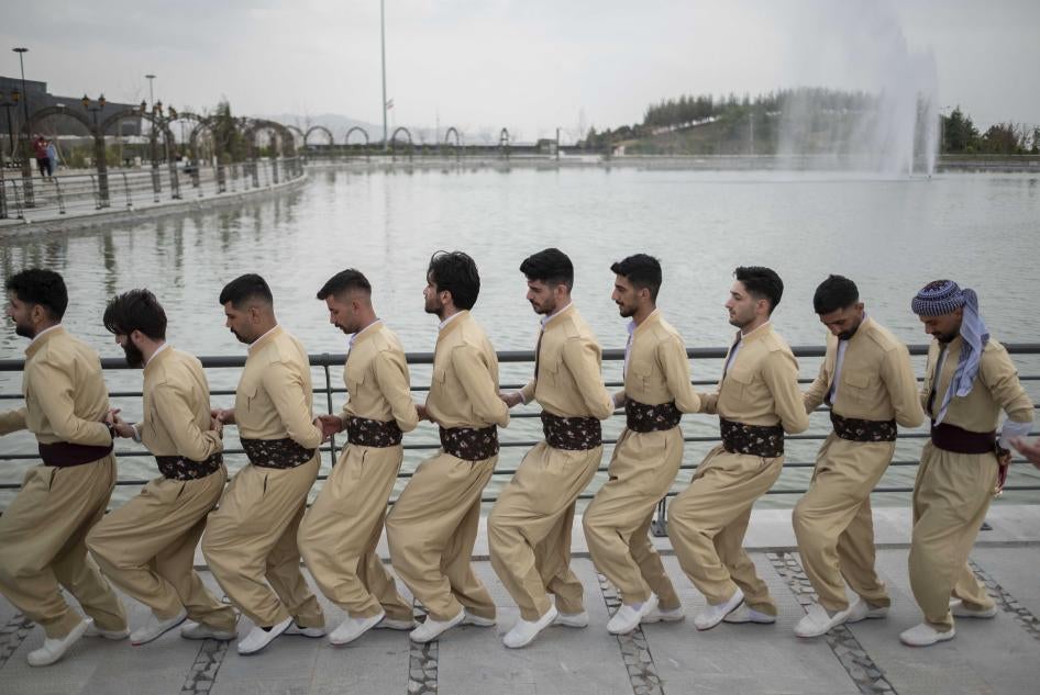 A group of Iranian-Kurds dance in a ceremony to mark Nowruz in Tehran, Iran, March 14, 2022.