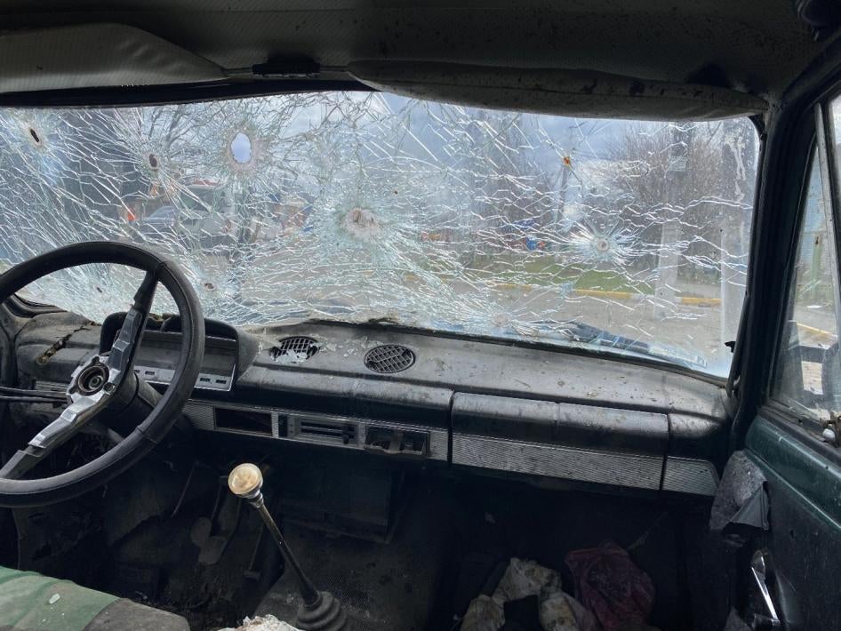 Maksym Maksymenko’s shot-up car in Hostomel, Ukraine. Russian forces opened fire on the vehicle on February 28, 2022 while Maksym was trying to evacuate with his mother, mother-in-law, wife, and their toddler son. Maksym and his wife were wounded, his mother died.