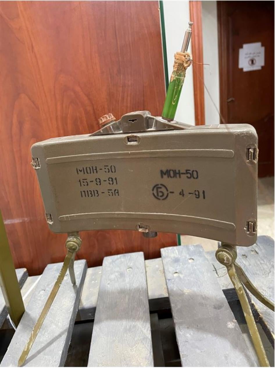 The rear view of an MON-50 antipersonnel mine produced in 1991 and equipped with a victim-activated MUV-series tripwire fuze displayed at Free Fields, Tripoli, Libya in March 2022.