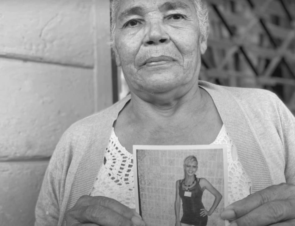 Rosa Hernández, mother of Vicky Hernández, holding a picture of her daughter.