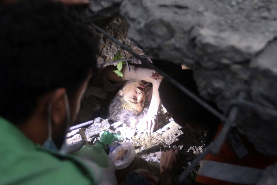 People try to rescue 17-year-old Nada Hisham Jweifel, stuck under the rubble of the Engineers’ Building, on October 31, 2023. She was injured, but survived the attack.