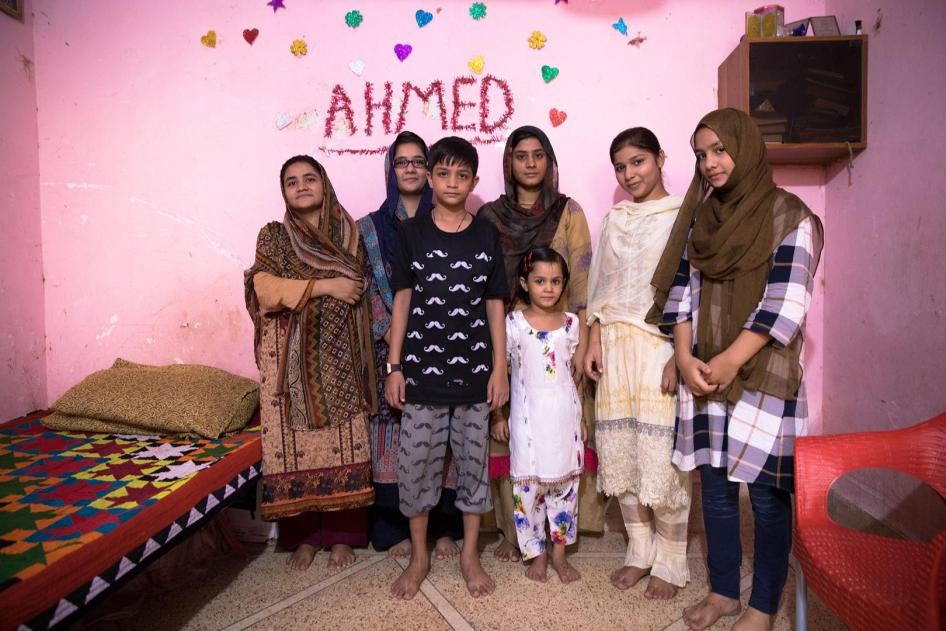 Bushra, second from the right, a 10th grader at Behar colony government Secondary School for girls, at home with her family. Bushra’s mother, far left, never studied; she married at age 14. 