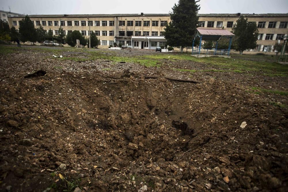 A crater in front of a school building