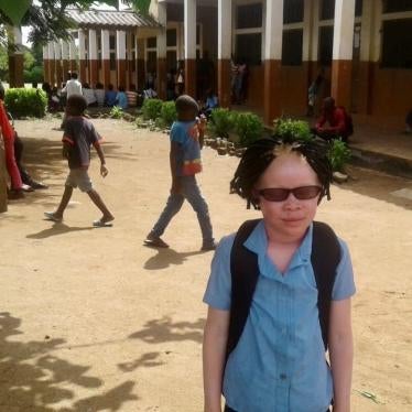 Josina wearing her new prescription glasses outside her classroom in Chiuta District in Mozambique’s Tete province. Since getting eyeglasses, Josina has been performing better academically, but now schools are closed because of the Covid-19 pandemic.