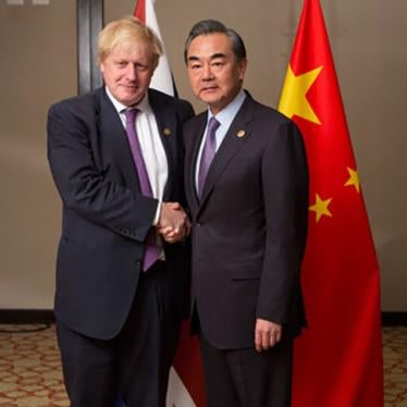 Then-United Kingdom Foreign Secretary Boris Johnson (L) meets with Chinese Foreign Minister Wang Yi at the G20 Foreign Ministers meeting in Buenos Aires, May 2018.