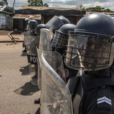 Police face supporters of Guinean opposition leader Cellou Dalein Diallo in Conakry, Guinea, Wednesday, Oct. 21, 2020.