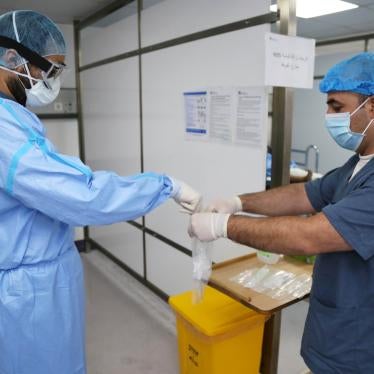 A doctor, wearing protective gear, handles a test for the coronavirus disease (COVID-19), at Rafik Hariri University Hospital, in Beirut, Lebanon October 1, 2020