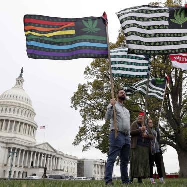 Supporters hold flags near the Capitol in Washington, DC, during a rally in favor of marijuana legalization on April 24, 2017.