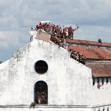 Inmates protest on the roof a prison building calling for speedier judicial processes and increased protection amid rising cases of Covid-19, Colombo, Sri Lanka, November 18, 2020.