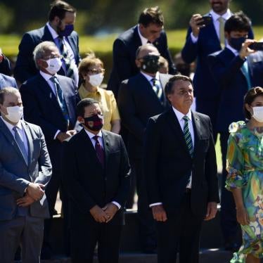 Brazil's President Jair Bolsonaro, without a mask, attends a ceremony at the Presidential Palace in Brasilia, along with ministers and other authorities, most of whom are wearing mask, on September 7, 2020. 