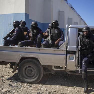 Heavily armed police are part of the group delivering Supreme Court justice Yvickel Dabrésil along with other detained individuals into custody at the penitentiary in Croix-des-Bouquets, Haiti, Feb. 9, 2021.