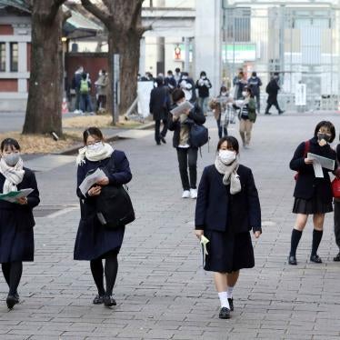 High school students wearing face masks walk in Tokyo, January 16, 2021. 
