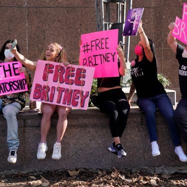 Britney Spears supporters pose for a photo outside a court hearing concerning the pop singer's conservatorship at the Stanley Mosk Courthouse in Los Angeles, February 11, 2021.