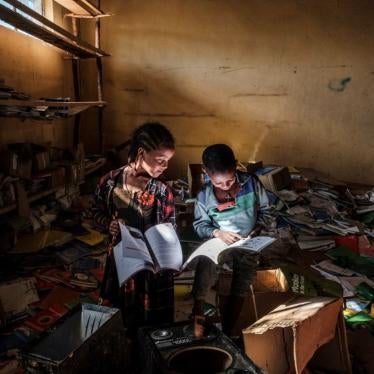 Children look at books in an elementary school in the village of Bisober, Tigray on December 9, 2020. The school was occupied by Tigray Special Forces and also damaged after fighting broke out between Ethiopian and Tigray forces in November 2020.
