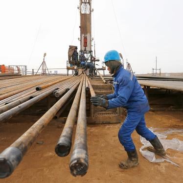 A worker prepares pipes to service an oil well on oil fields operated by a subsidiary of the KazMunayGas Exploration Production JSC in Kyzylorda region, southern Kazakhstan on January 21, 2016.