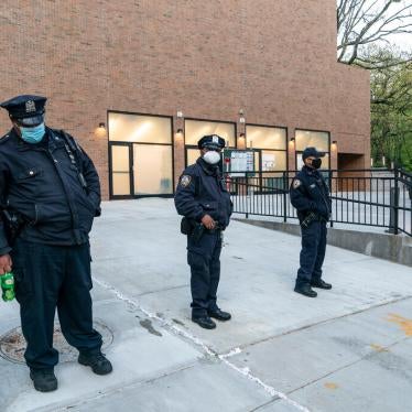 Police stand guard in front of the Young Israel of Riverdale synagogue where glass windows were smashed in New York on April 25, 2021.