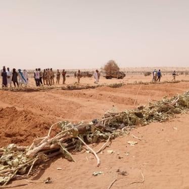 Villagers at a mass grave containing the remains of civilians killed during the March 21, 2021 attack by armed Islamist groups on villages in Tahoua region, Niger. More than 170 Tuareg villagers were killed in the attack, Niger’s worst atrocity in recent history.