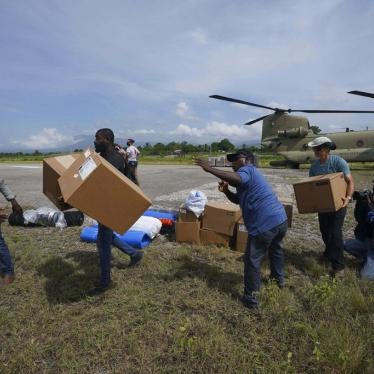 Residents help Team Rubicon's disaster response team unload aid at the airport from a US Army helicopter to take to the hospital where the team is treating residents injured in the 7.2 magnitude earthquake in Les Cayes, Haiti, Thursday, August 19, 2021. 