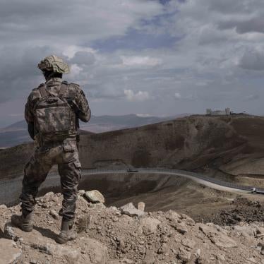 A Turkish soldier stands at the Turkish border with Iran