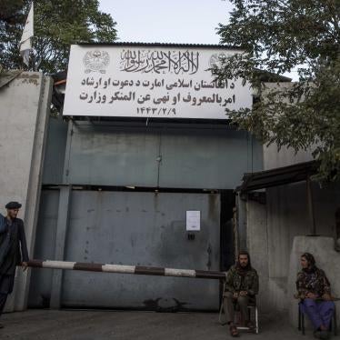 Taliban fighters stand guard at the entrance to the former Ministry of Women Affairs, which the Taliban has replaced with the Ministry of Vice and Virtue, which oversees the implementation of hardline Islamic rules in Afghanistan.