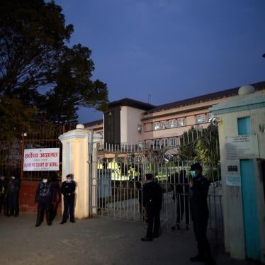 Police stand outside the Supreme Court of Nepal on February 23, 2021, following its ruling to reinstate the dissolved House of Representatives.