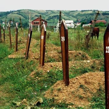 Unmarked graves in Djakovca (Gjakove) cemetery, July 1999. Witnesses said that Serbian forces exhumed and moved at least 70 bodies from here in May of that year.