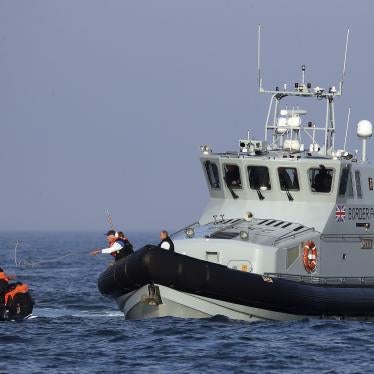 Border Force officers assist 20 Syrian migrants aboard HMC Hunter after they were stopped as they crossed The Channel in an inflatable dinghy headed in the direction of England.