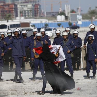 An anti-government protestor gestures in front of police as demonstrators re-occupy Pearl roundabout on February 19, 2011 in Manama, Bahrain. Ten years after the anti-government protests, virtually all opposition has been quashed.
