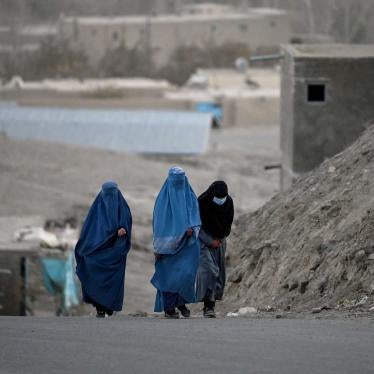 Burqa-clad women walk on a street in Ghazni City, in Ghazni province, Afghanistan.