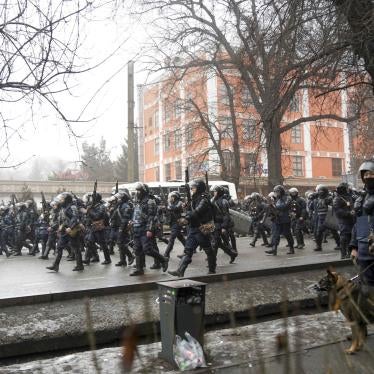 Kazakh riot police walk to block demonstrators gathering during a protest in Almaty, Kazakhstan, January 5, 2022. 