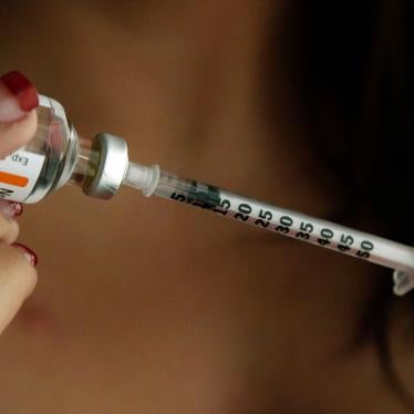 A woman fills a syringe with insulin at her home in the Los Angeles suburb of Commerce, California, April 29, 2019.