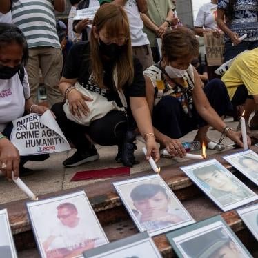 Relatives of “drug war” victims light candles after the International Criminal Court allowed the ICC prosecutor to resume his investigation into alleged crimes against humanity in the Philippines, Quezon City, July 18, 2023. 
