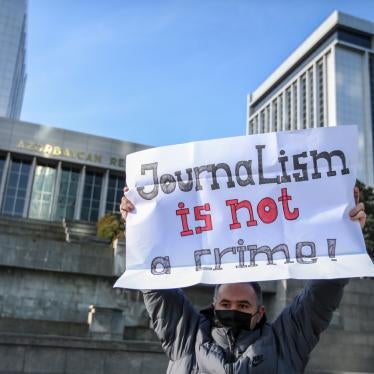 Ulvi Hasanli, director of "Abzas Media" online publication is seen during a rally of journalists against a new media bill, in front of the Parliament building in Baku, Azerbaijan, December 28, 2021. 