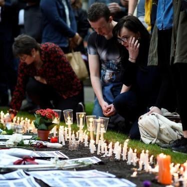 People light candles during a vigil in memory of the victims of the gay nightclub mass shooting in Orlando, at St Anne's church in the Soho district of London, June 13, 2016. 