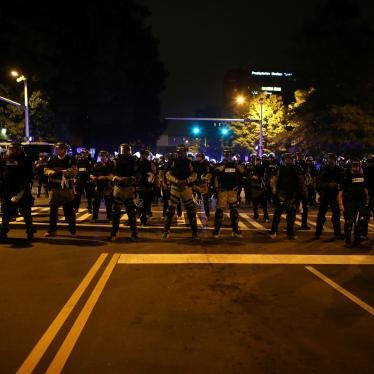 Police in riot gear block a roadway to stop demonstrators from entering a neighborhood as they protest the police shooting of Keith Scott in Charlotte, North Carolina, U.S., September 25, 2016.