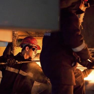 Workers at the ArcelorMittal steel plant in Temirtau, June 13, 2012.