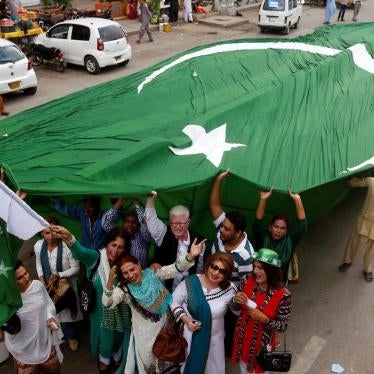 Supporters of civil rights group for transgender people, the Gender Interactive Alliance (GIA), dance and chant slogans as they pose with a national flag ahead of the Independence Day in Karachi, Pakistan August 3, 2016