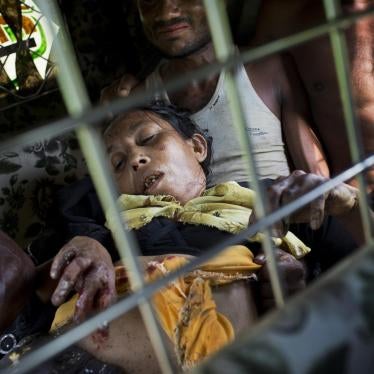 A Rohingya woman travels to a hospital near Kutupalong, Bangladesh, after a landmine blew off her right leg while she was crossing the border from Burma, September 4, 2017.