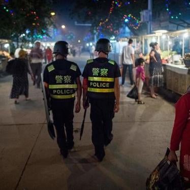 Chinese police patrol a night market near Id Kah Mosque in Xinjiang, a day before the Eid al-Fitr holiday, June 25, 2017.