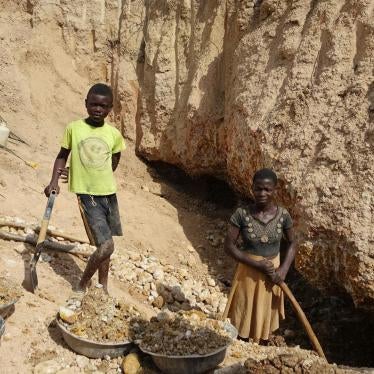 A boy and a girl work in a small gold mine in Amansie West district, Ghana.